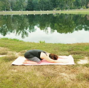 Here, Kimberli is in Child's Pose or Balasana. She likes to use this pose when her hips and back are hurting her. She says this pose also helps with her migraines. 